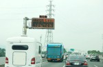 Traffic jam due to accident. The sign says "70 minutes to go 12 kilometers"