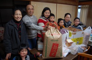 The Tayama family with some of the supplies they received.