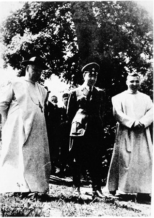 Ante Pavelic, center, with Vatican Nuncio or legate Ramiro Marcone, left, and Vatican Secretary to the Nuncio Giuseppe Masucci, at a ceremony in Zapresic, a town northwest of Zagreb.