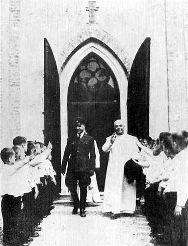NDH Poglavnik Ante Pavelic, left, with the Papal Emissary Ramiro Marcone.
