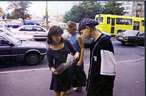 Russian girl distributing literature to an Estonian boy