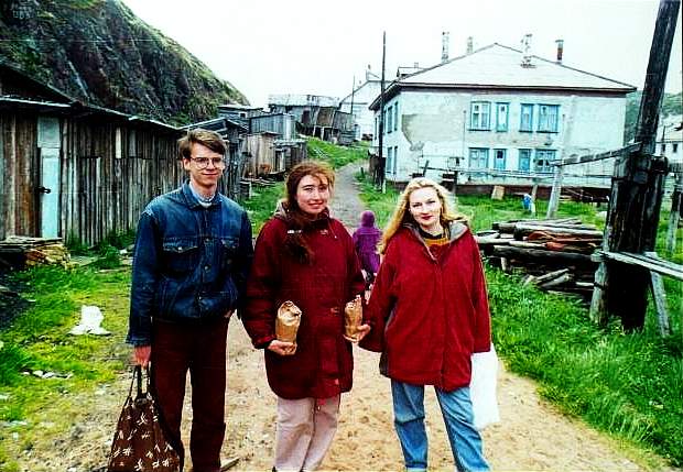 Yakek, Angela and Teriberka resident Marina near her apartment.