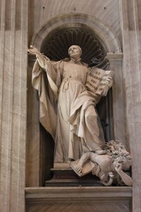 Statue of Ignatius Loyola in St Peters Basilica in Rome with his foot on a Protestant Christian holding his Bible.